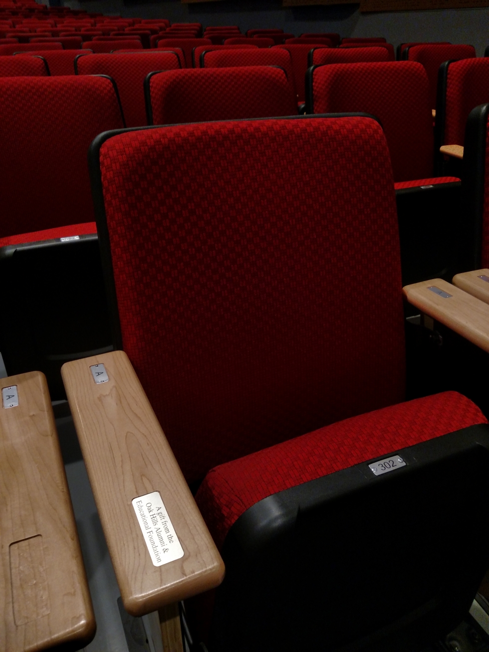 Photo of red fabric seat in newly renovated auditorium